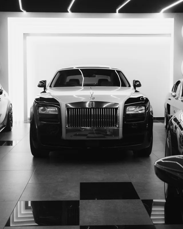 Rolls-Royce Ghost facing the camera, photographed in black and white